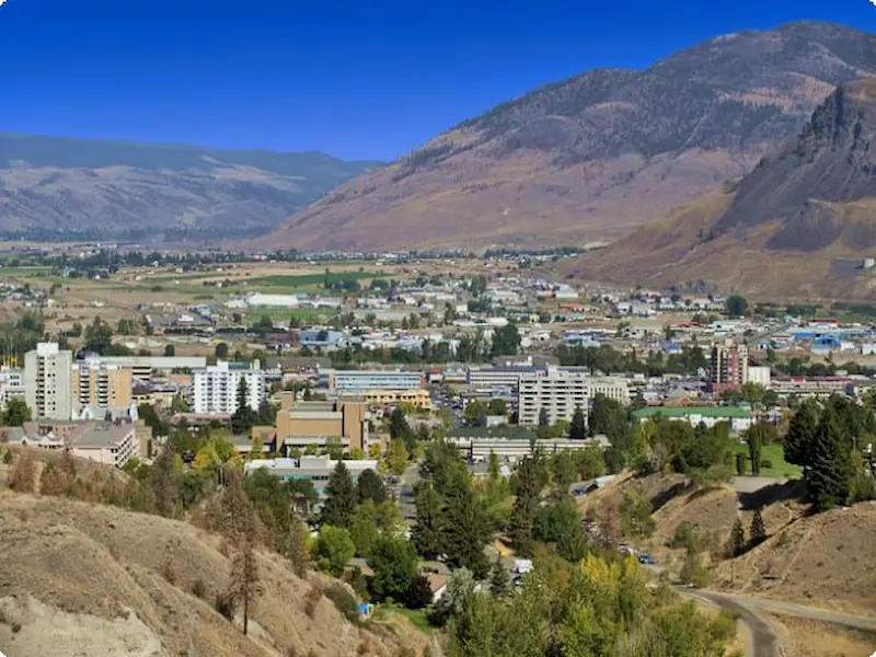 Panoramic summer view of Kamloops, the hottest city in Canada, with dry hills and blue skies.