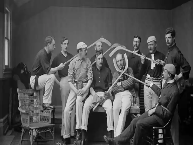 Historic photo of Canadian men with hockey sticks – origins of the most popular sport in Canada